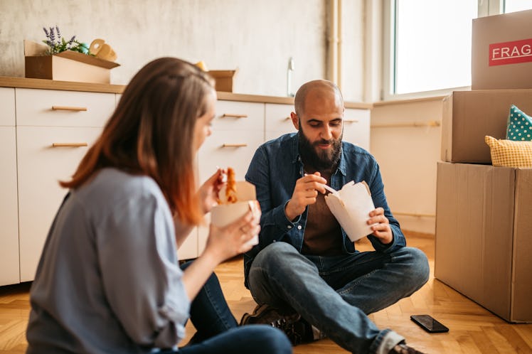 The Pros & Cons Of Moving In Together, According To Dating Experts