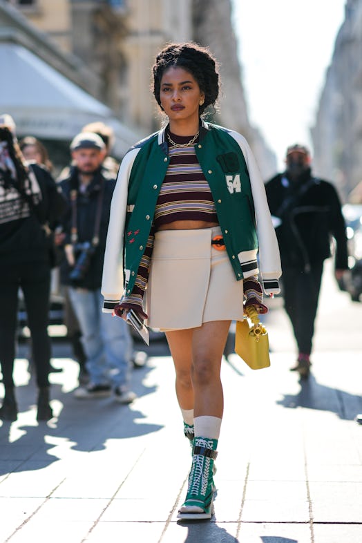 A guest wore a TikTok summer trending beige mini skirt during Paris Fashion Week on March 07, 2022.