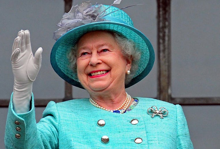 Britain's Queen Elizabeth II waves from the balcony of Council House in Nottingham, central England,...