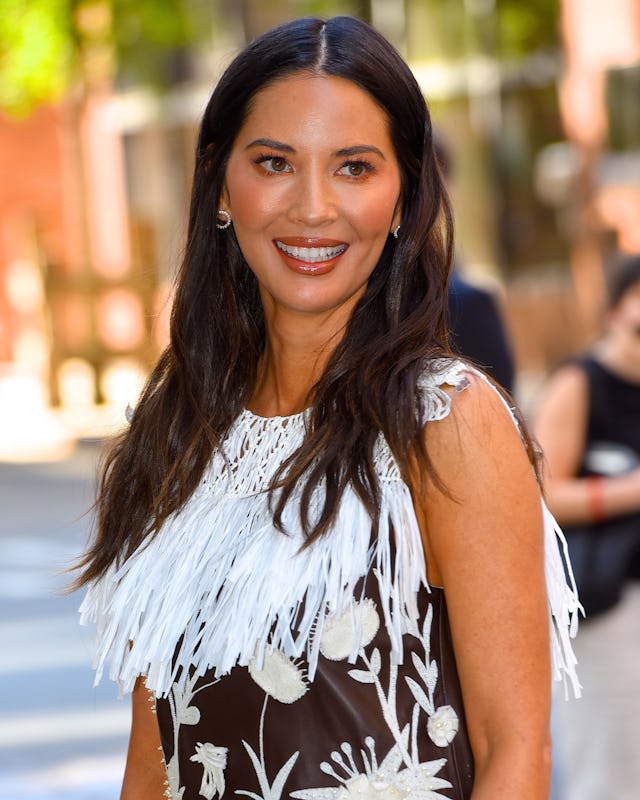 Olivia Munn is killing the mom game. Here, she is seen out and about in Manhattan in 2019.