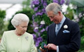 Britain Queen Elizabeth II presents to Prince Charles with a Royal Horticultural Society's Victoria ...