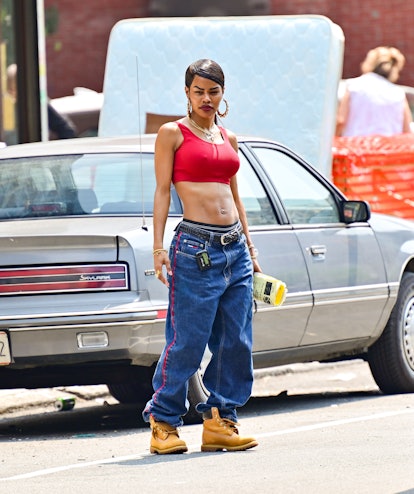 Teyana Taylor in low-rise jeans and red sports bra