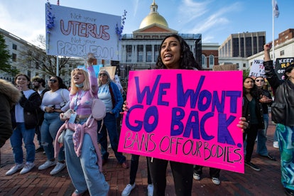 Pro-choice demonstrators rally outside the State House during a Pro-Choice Mother's Day Rally in Bos...