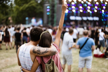Couple considering having sex at a music festival 