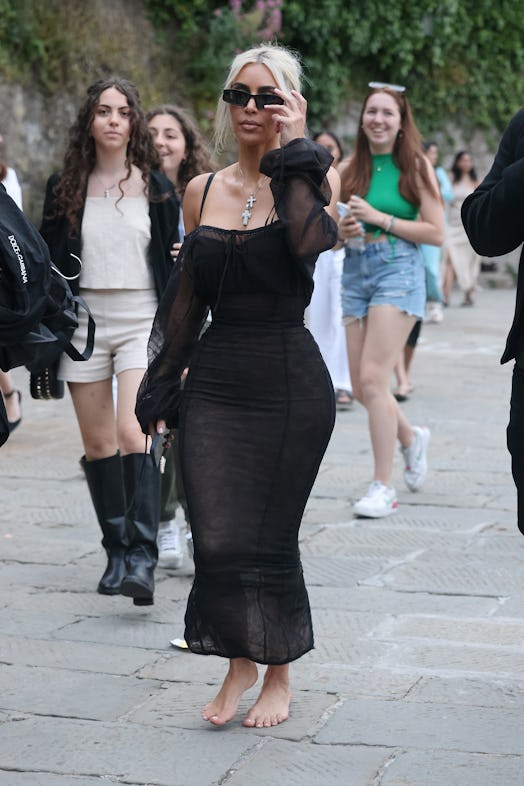 kim kardashian wearing a sheer black off-the-shoulder dress in Italy 