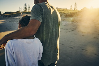 father with his arm around son, how to co-parent with a toxic ex