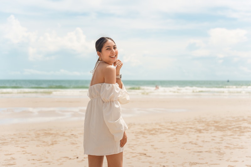woman wearing a summer dress on the beach