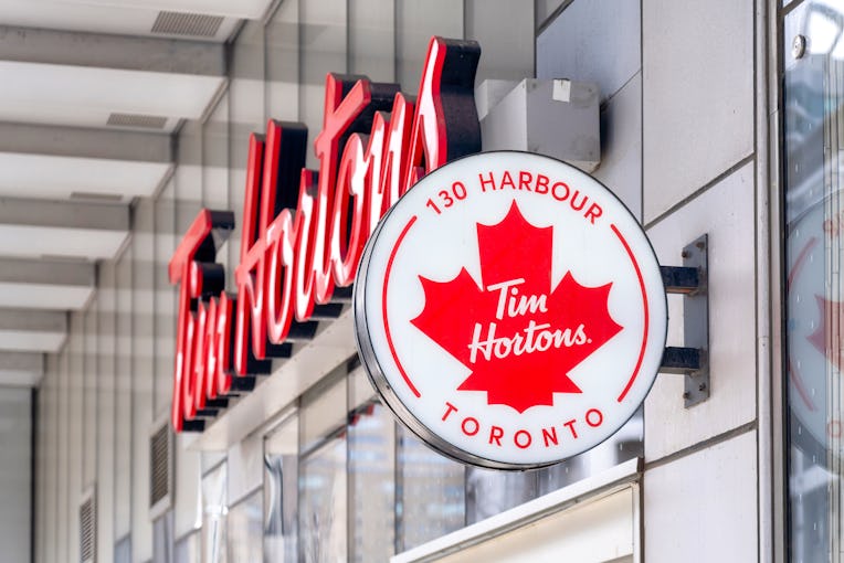 TORONTO, ONTARIO, CANADA - 2022/05/23: Business sign of a Tim Horton's cafeteria. The food and drink...