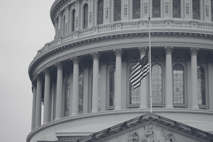 The U.S. flag flies at half-staff on top of the U.S. Capitol building in Washington, D.C., the Unite...