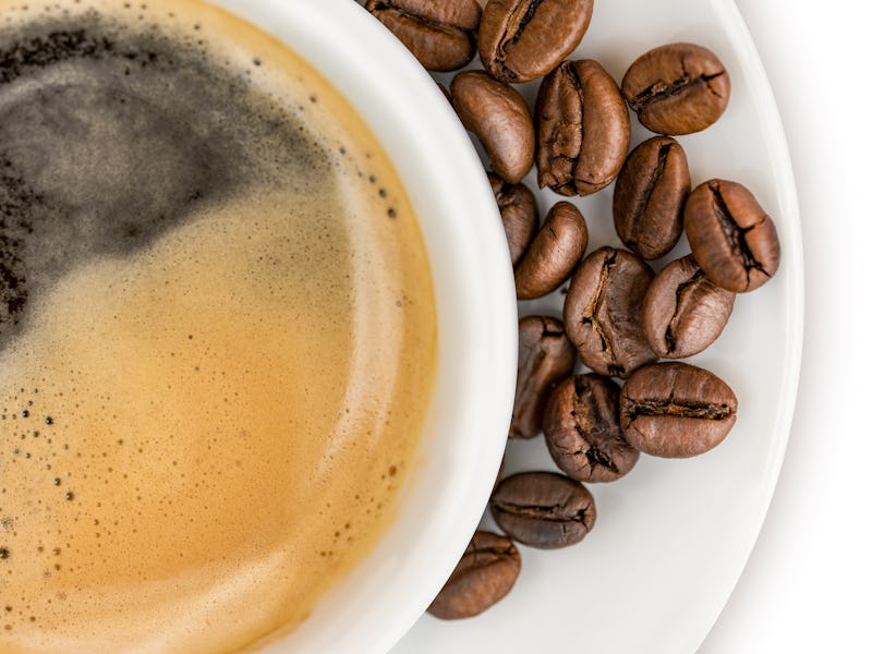 Coffee Beans and a Cup of Coffee on White
