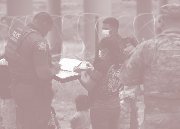 Migrants are apprehended by US Border Patrol and National Guard troops in Eagle Pass, Texas, on May ...