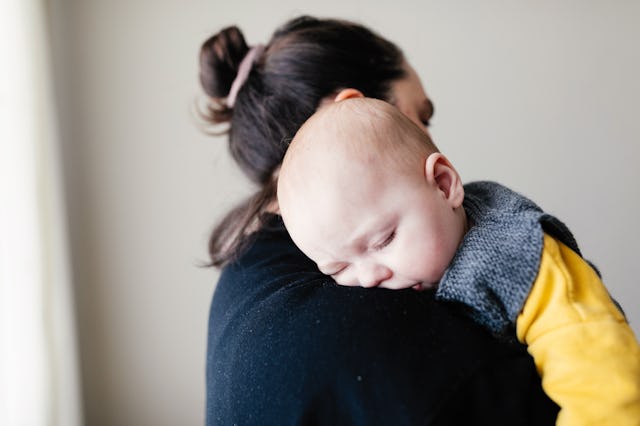 Mother holding her sleeping son