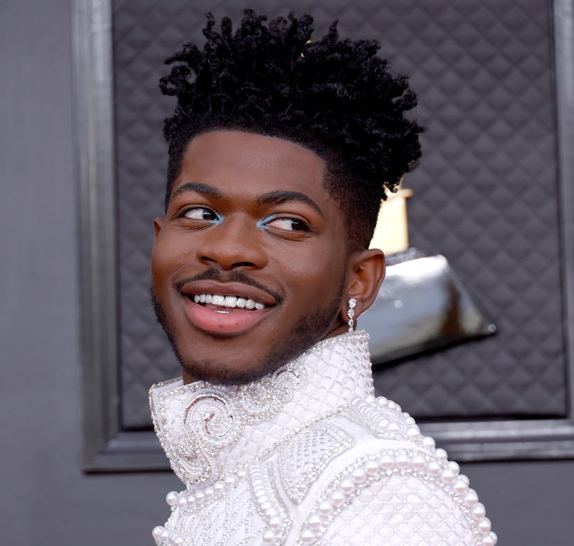 Lil Nas shows off short hair at the Grammys very different from his current long, blond hair reminis...