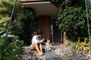 Day in the life of a young Aussie mum outside her house with her toddler daughter