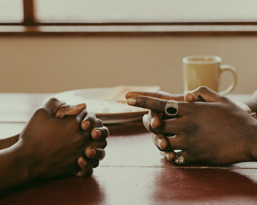 couple sitting at table, how to talk to husband about having a baby