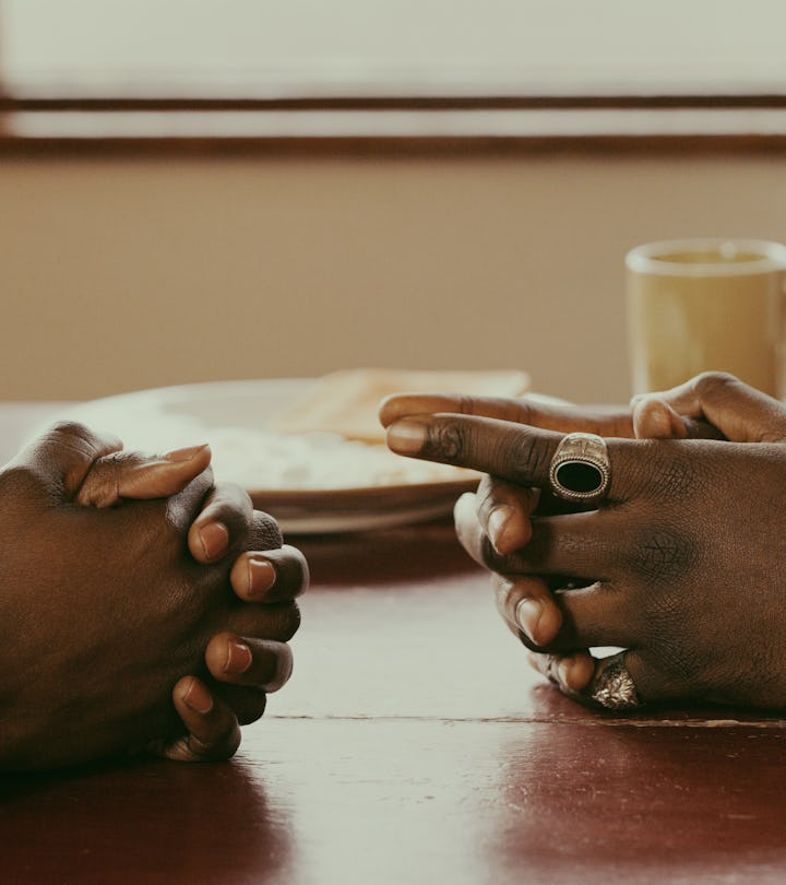 couple sitting at table, how to talk to husband about having a baby