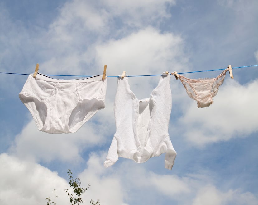 family underwear hanging on clothesline, how to get poop stains out of clothes