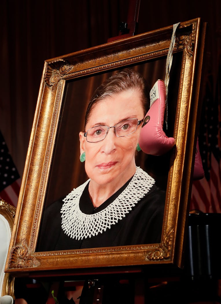 WASHINGTON, DC - MARCH 11: A pair of pink boxing gloves hangs on a portrait of the late Supreme Cou...