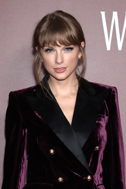 taylor swift wearing a velvet, double-breasted suit
