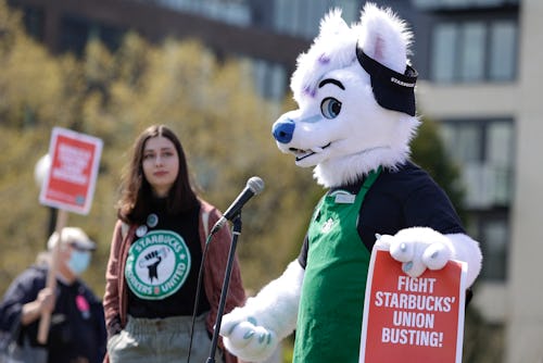 Michael Vestigo of Kansas City, Kansas, who claims he was fired by Starbucks, speaks while dressed a...