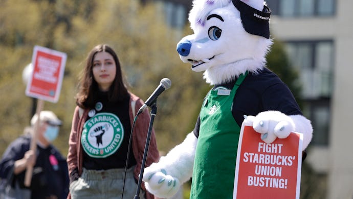 Michael Vestigo of Kansas City, Kansas, who claims he was fired by Starbucks, speaks while dressed a...