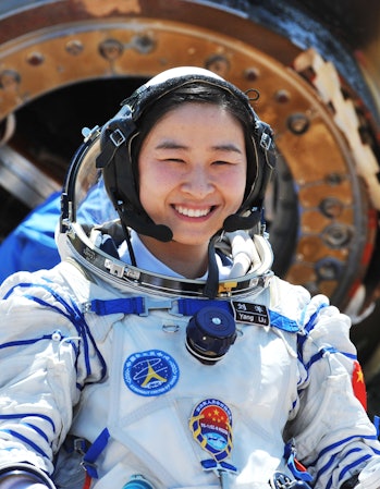 SIZIWANG BANNER, CHINA - JUNE 29: Chinese astronaut Liu Yang reacts after coming out of the re-entry...
