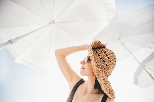 Woman relaxing on beach.