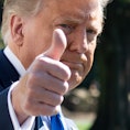 US President Donald Trump gives a thumbs-up as he departs the White House in Washington, DC, on Octo...