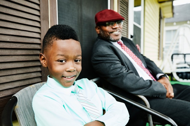 boy sitting in chair next to uncle, instagram captions for your uncle on father's day