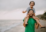 laughing dad with daughter on shoulders, funny happy father's day memes