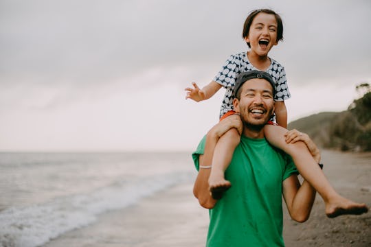 laughing dad with daughter on shoulders, funny happy father's day memes