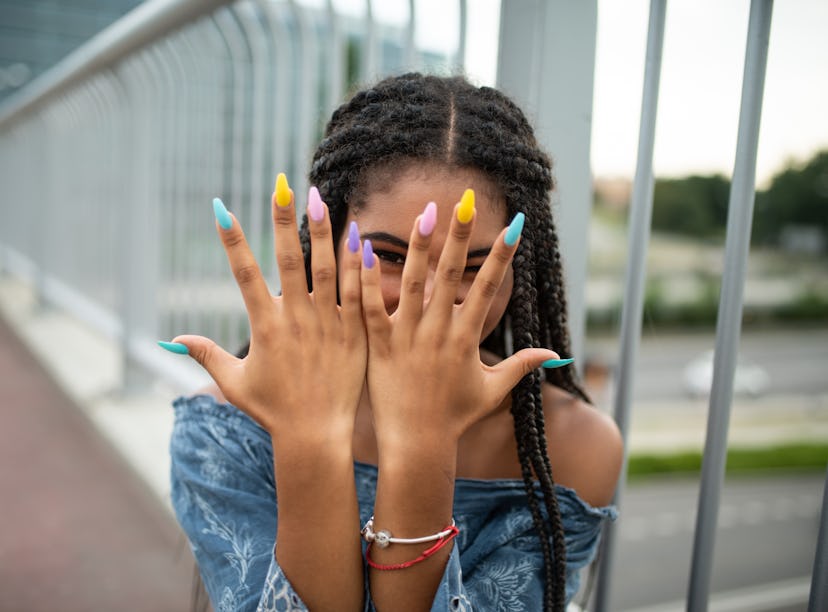 model whose DIY nails look like a professional manicure after following tips on how to get professio...