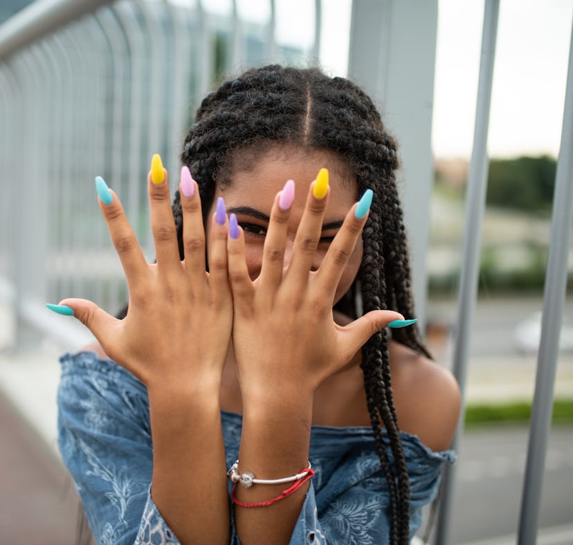 model whose DIY nails look like a professional manicure after following tips on how to get professio...
