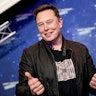 SpaceX owner and Tesla CEO Elon Musk poses as he arrives on the red carpet for the Axel Springer Awa...