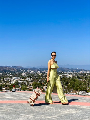 PARIS, FRANCE - MAY 13: Julia Comil wears a lime sorbet cropped linen cami top by Bondi Born, lime s...