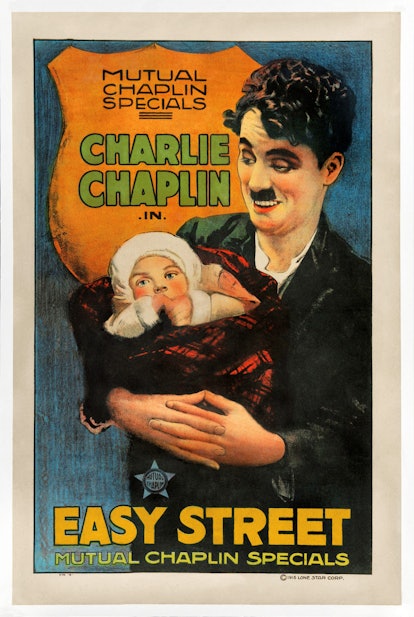 One-sheet movie poster advertises 'Easy Street,' a silent comedy starring Charlie Chaplin and Edna P...