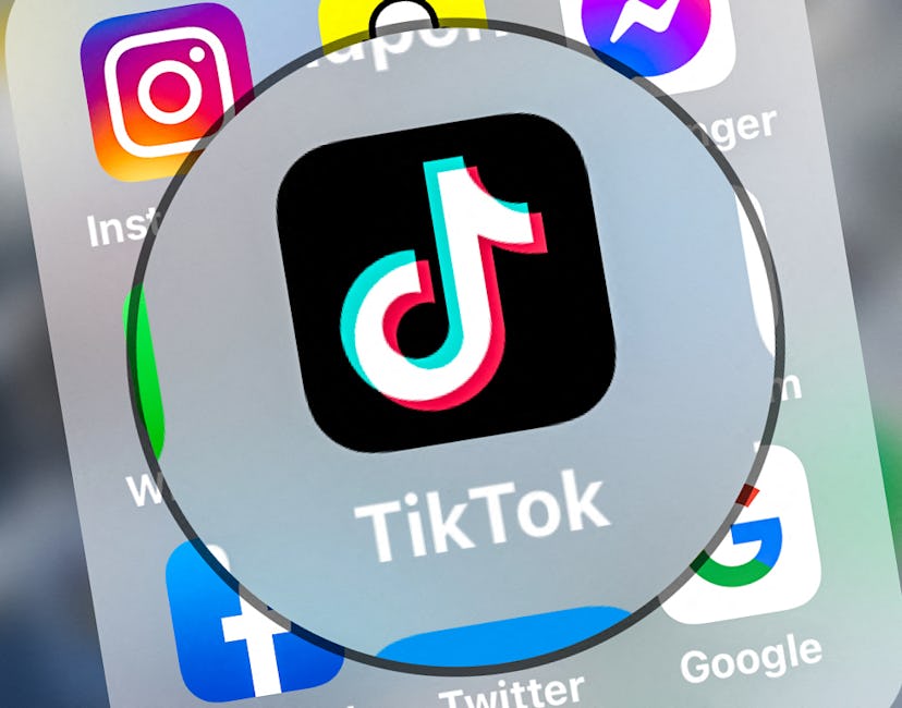 This photograph taken on March 23, 2022, shows logo of the networking application TikToK displayed o...