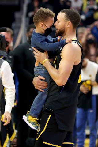 Steph Curry holding his son. Ayesha Curry, Steph's wife, shared a video of her 3-year-old son dribbl...