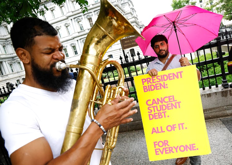 Student debt borrowers gather with a brass band for their monthly “Cancel Student Debt - All of it f...