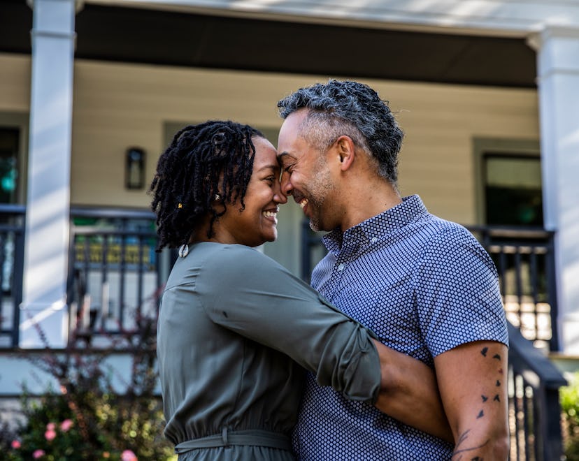husband and wife hugging, father's day pregnancy announcements