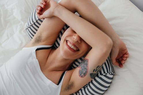 Young woman relaxing on the bed in her spare time.