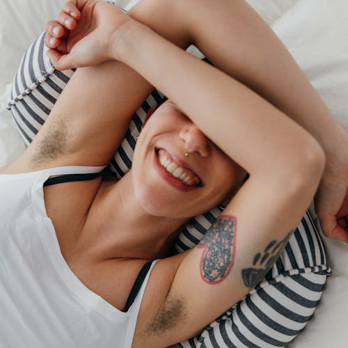 Young woman relaxing on the bed in her spare time.