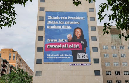 WASHINGTON, DC - MAY 18: A 50 Foot billboard urging President Joe Biden to cancel student loan debt ...