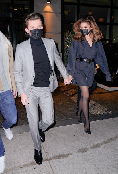 zendaya wearing a little black dress with stockings and pumps while out with boyfriend tom holland 