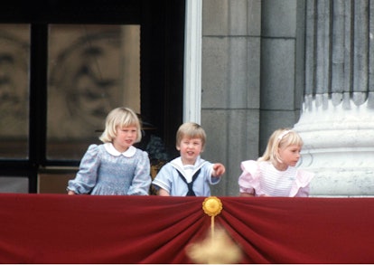 Zara Phillips, Prince William and Lady Davina Windsor stand on the balcony of Buckingham Palace duri...