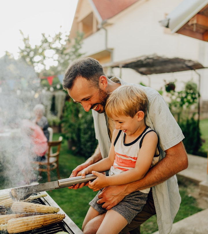 Photo of father showing his boy how to grill, father's day gifts from costco