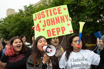 FAIRFAX, VA - MAY 27: (NY & NJ NEWSPAPERS OUT) Johnny Depp fans express their support of the actor o...