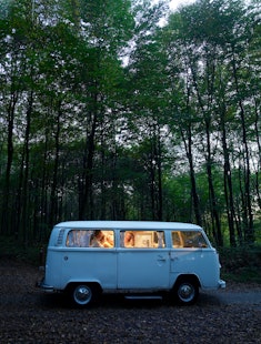 vintage van in the woods, best summer travel destinations for families