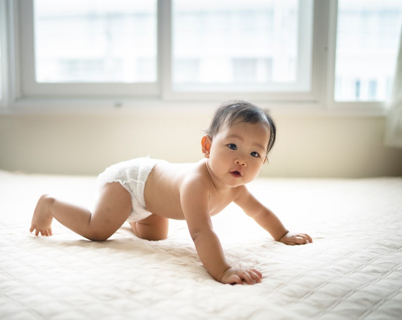 baby crawling on bed, baby names that start with j