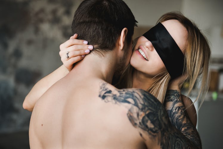 Shot of an affectionate young couple sharing an intimate moment in their living room